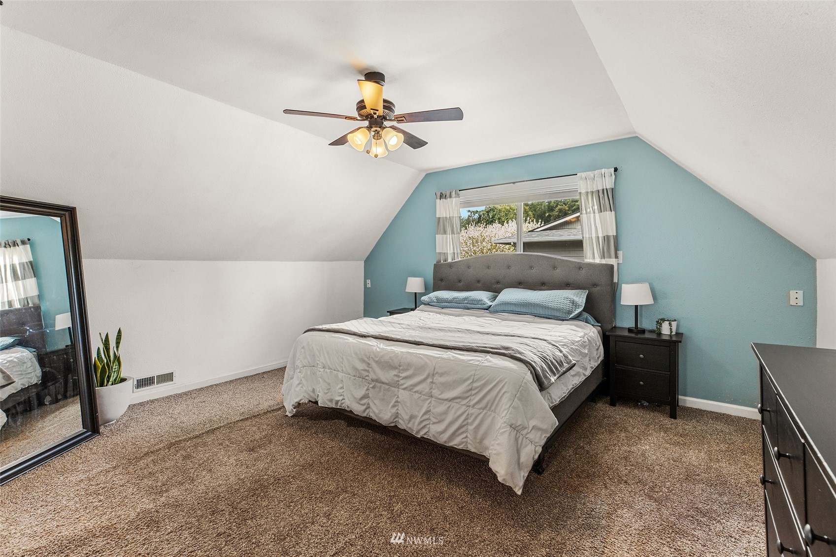 14627 Southeast 140th Street Renton, WA 98059 - Photo 18 of 33 a bedroom with a bed and a chandelier