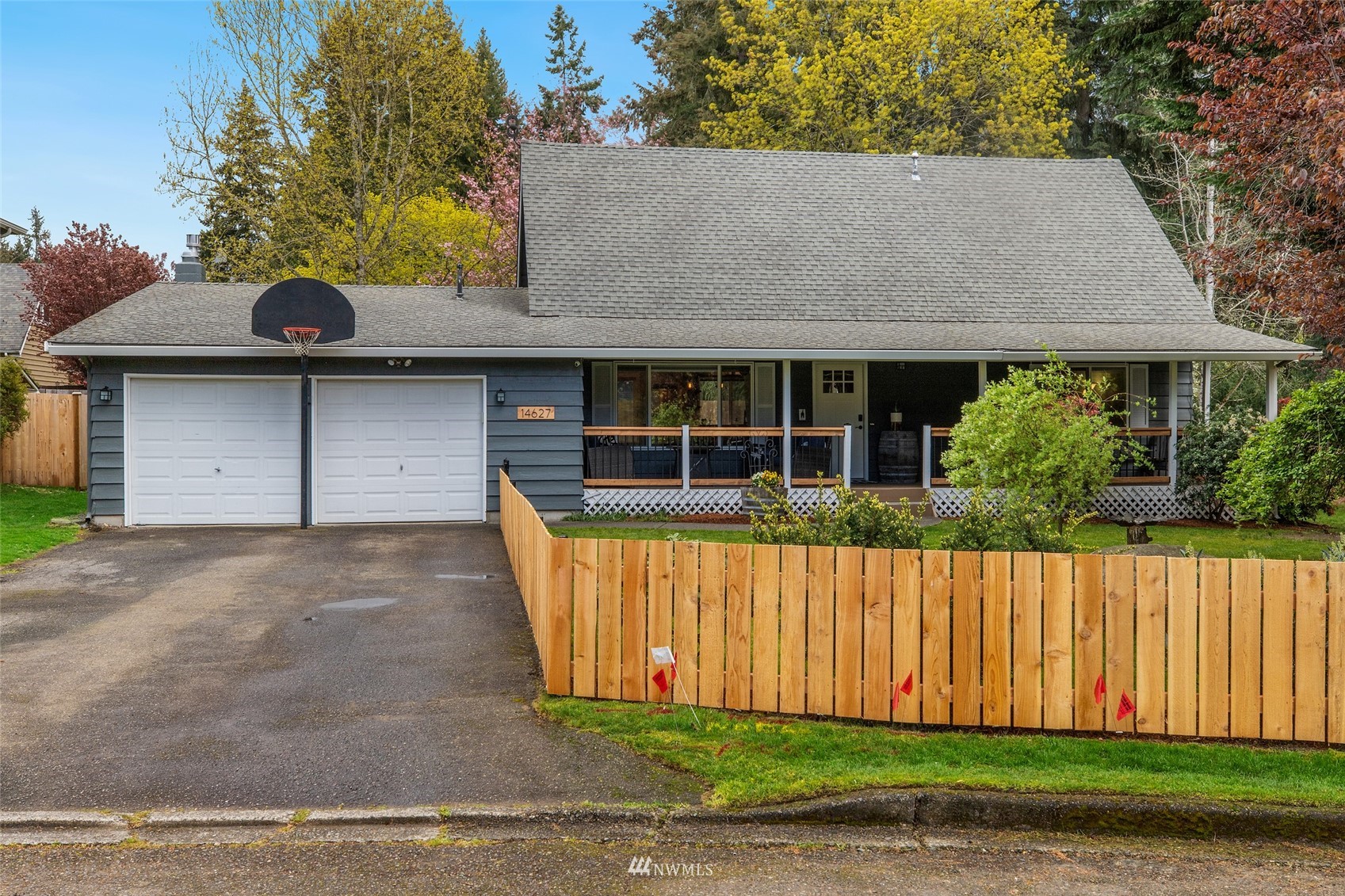 14627 Southeast 140th Street Renton, WA 98059 - Photo 2 of 33 a front view of a house with a garden