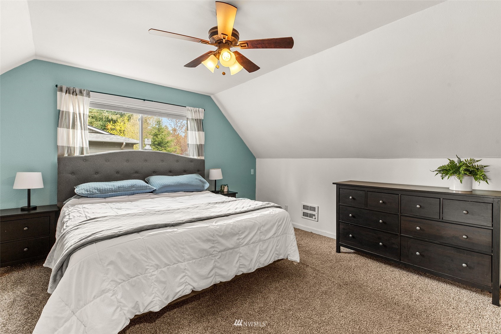 14627 Southeast 140th Street Renton, WA 98059 - Photo 21 of 33 a bedroom with a bed a window and a chandelier fan