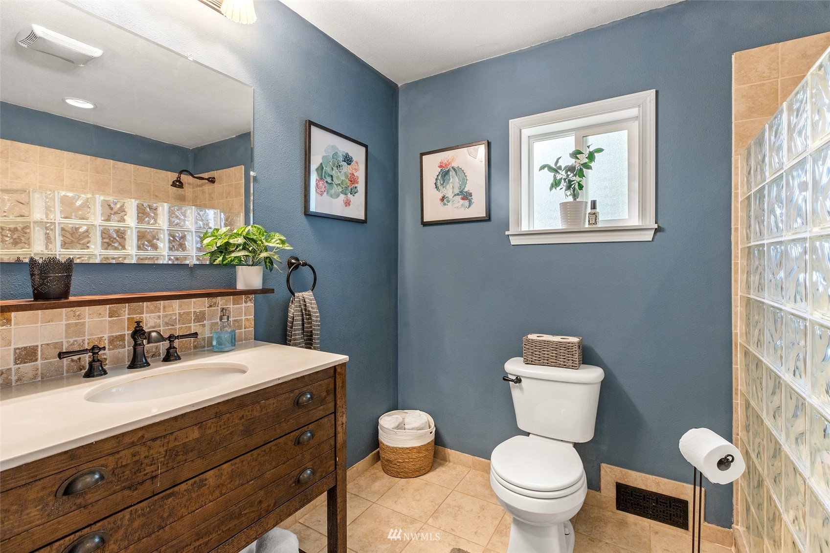 14627 Southeast 140th Street Renton, WA 98059 - Photo 23 of 33 a bathroom with a toilet a sink and a large mirror
