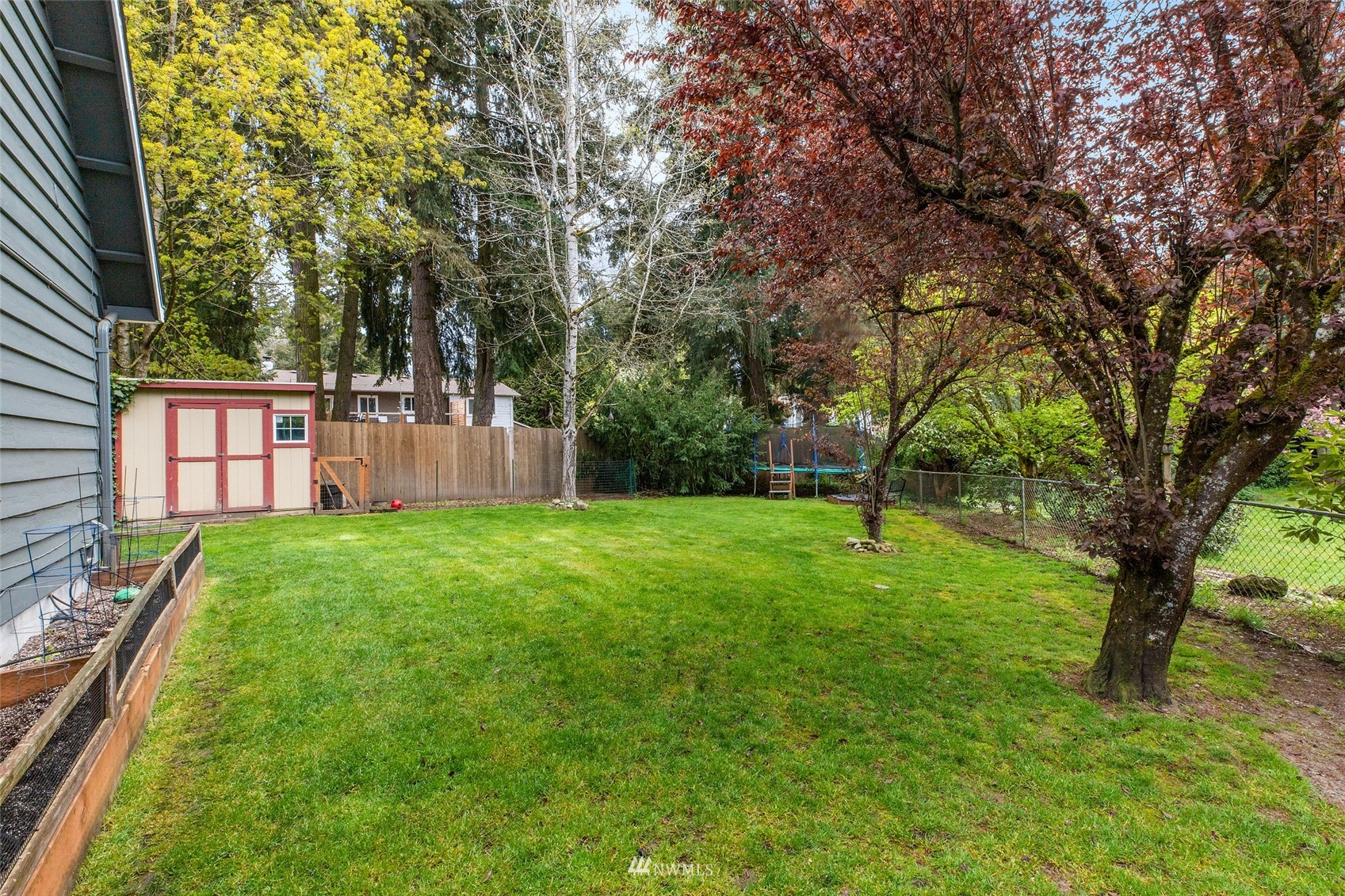 14627 Southeast 140th Street Renton, WA 98059 - Photo 26 of 33 a view of a backyard with a garden