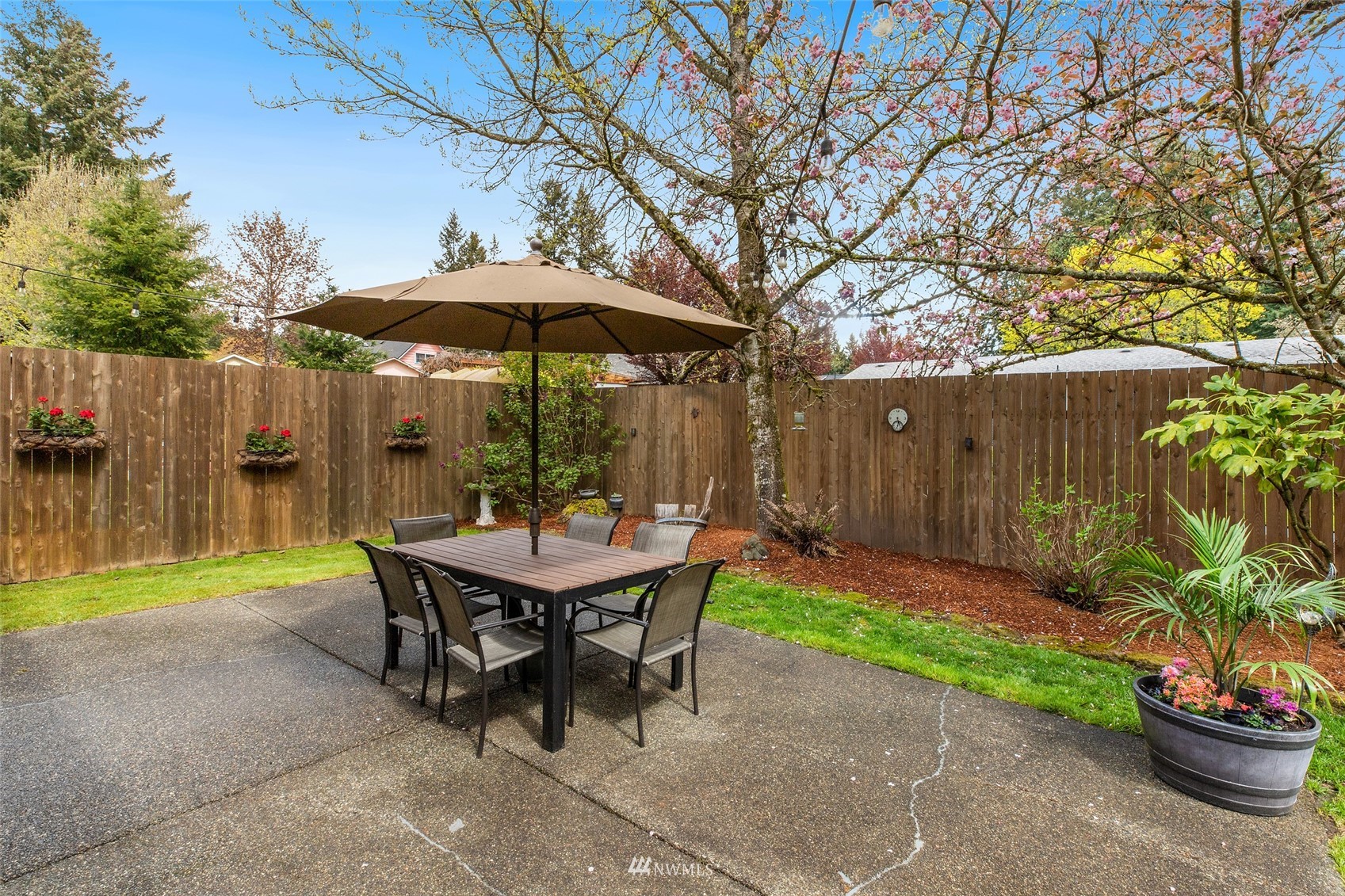 14627 Southeast 140th Street Renton, WA 98059 - Photo 30 of 33 a backyard of a house with table and chairs