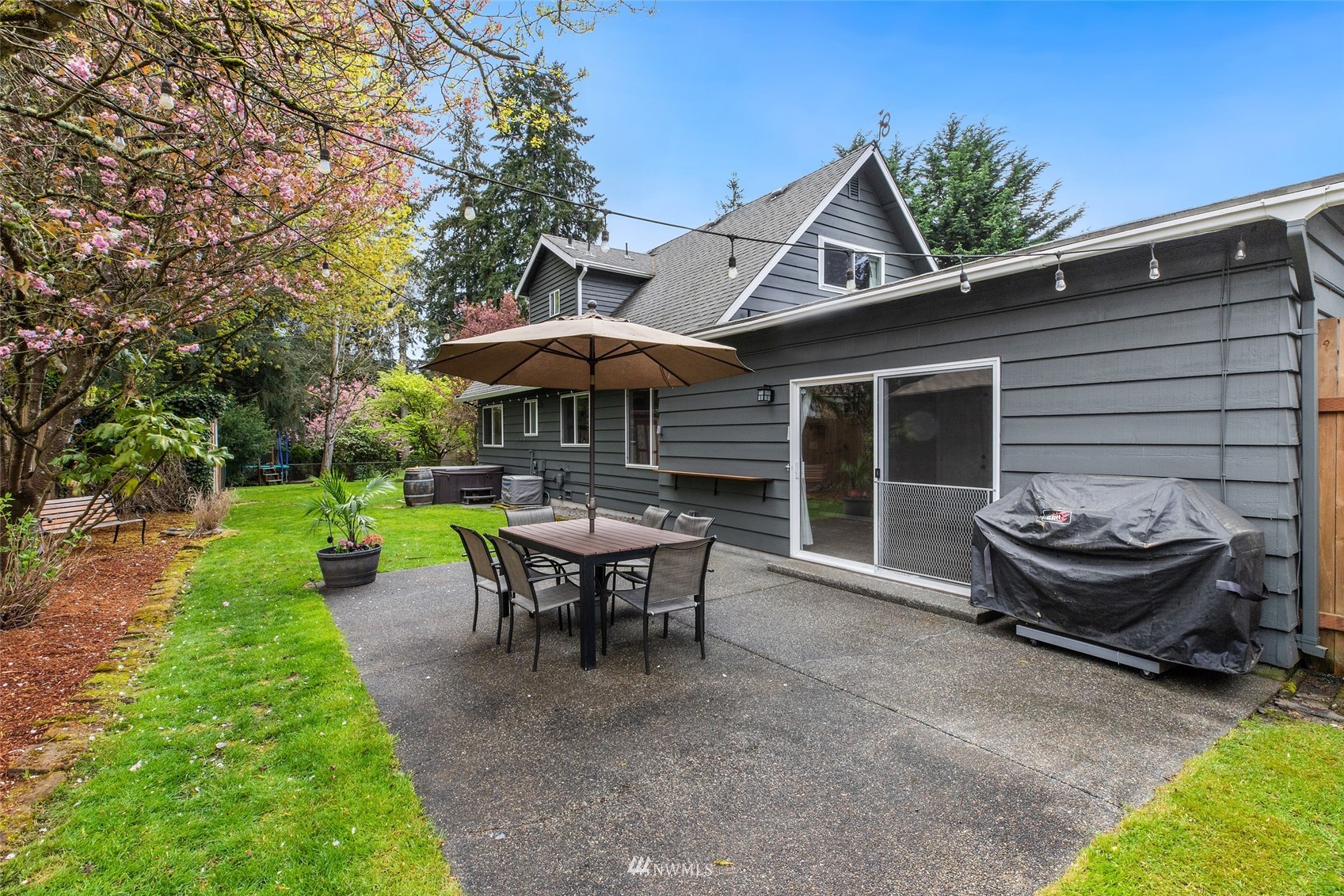 14627 Southeast 140th Street Renton, WA 98059 - Photo 31 of 33 a view of a house with backyard sitting area and garden