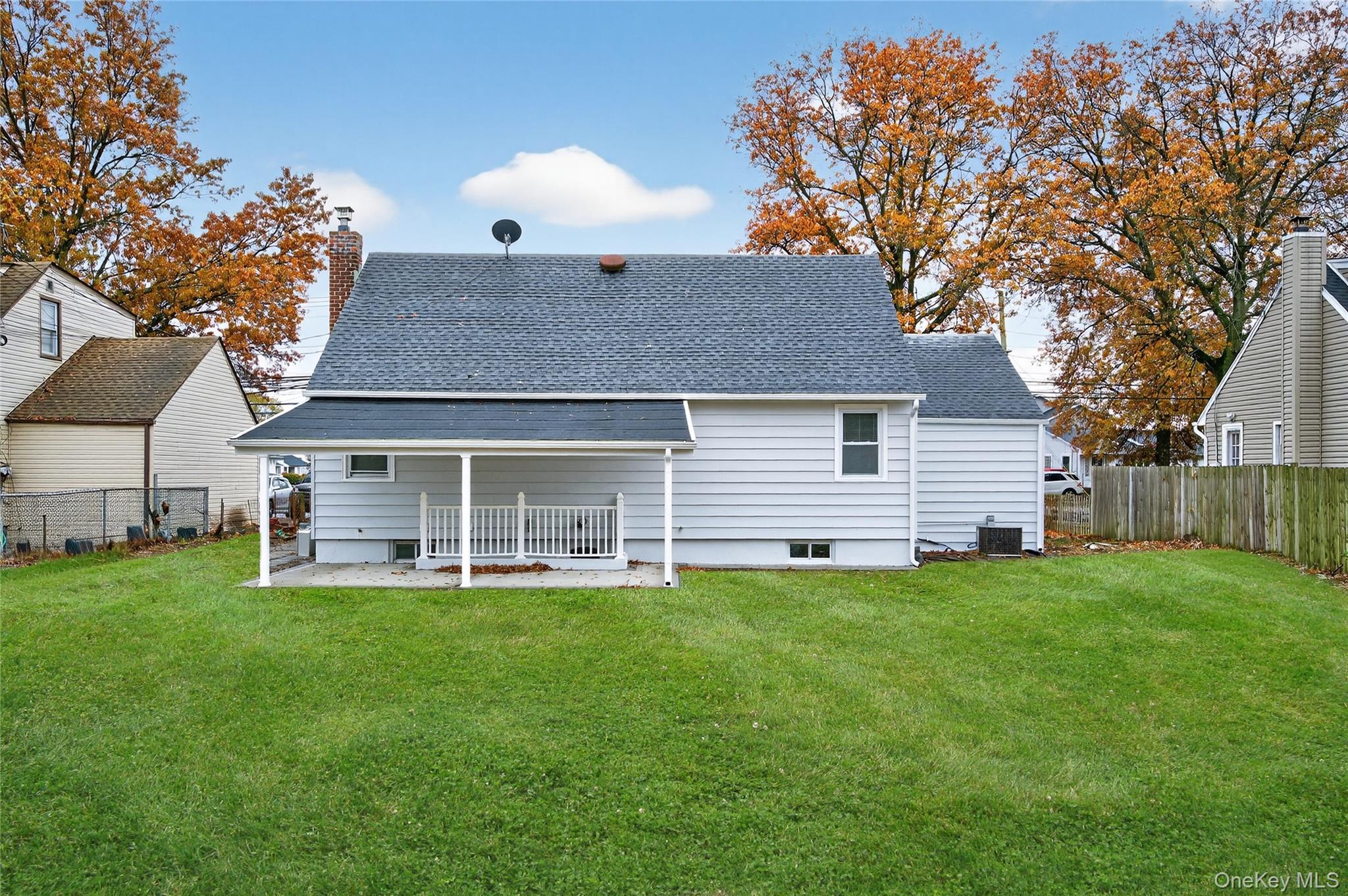 552 Old Country Road Plainview, NY 11803 - Photo 19 of 19 a front view of a house with a yard and garage