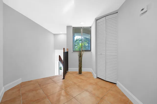 a view of a bathroom with a sink and natural light
