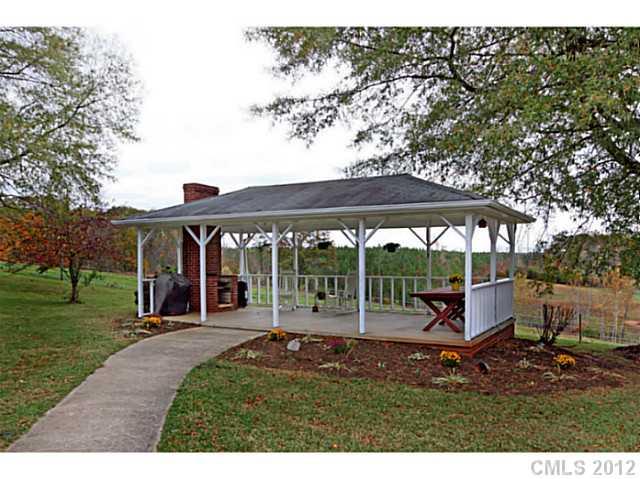 235 Thacker Road Rural Hall, NC 27045 - Photo 2 of 16 an outdoor view of house with backyard and glass space