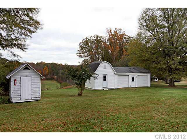 235 Thacker Road Rural Hall, NC 27045 - Photo 14 of 16 a front view of a house with a yard and garage