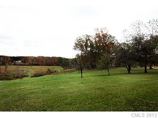 235 Thacker Road Rural Hall, NC 27045 - Photo 3 of 16 a view of three trees in a field