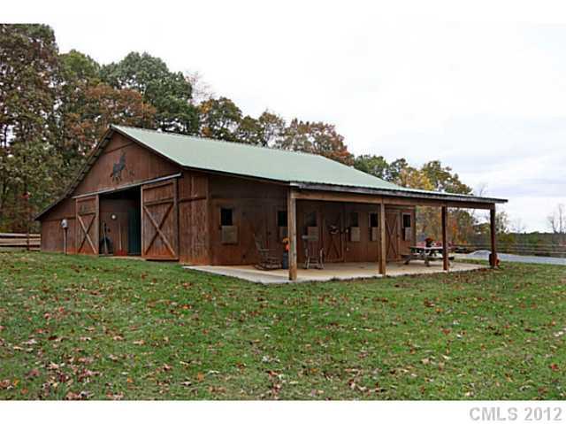 235 Thacker Road Rural Hall, NC 27045 - Photo 5 of 16 a view of a house with a yard and sitting area