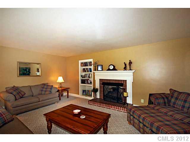 235 Thacker Road Rural Hall, NC 27045 - Photo 8 of 16 a living room with furniture and a fireplace