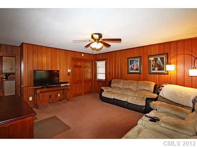 235 Thacker Road Rural Hall, NC 27045 - Photo 9 of 16 a living room with furniture and a flat screen tv