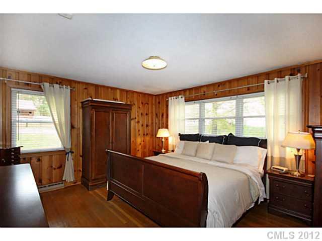 235 Thacker Road Rural Hall, NC 27045 - Photo 10 of 16 a bedroom with a bed and a large window