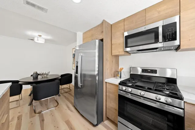 a kitchen with a stove and a microwave