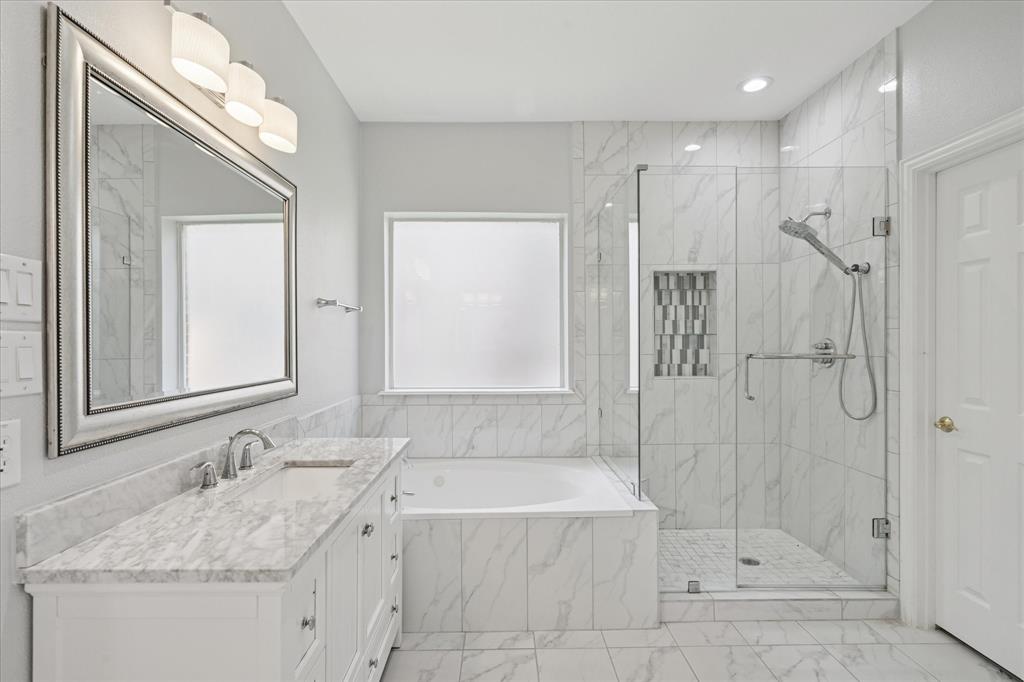 610 Spring Hill Drive Coppell, TX 75019 - Photo 12 of 15 a bathroom with a granite countertop sink mirror and shower