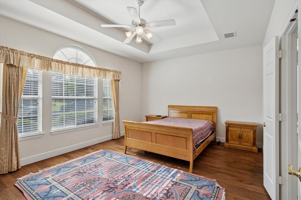 610 Spring Hill Drive Coppell, TX 75019 - Photo 10 of 15 a room with a bed and a window