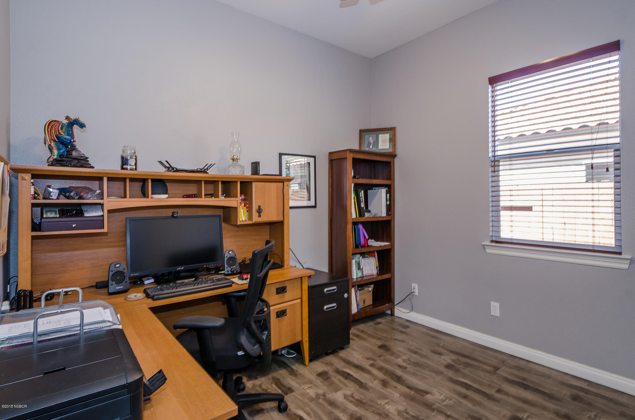 716 Enterprise Avenue Lompoc, CA 93436 - Photo 18 of 43 a view of a workspace with furniture and a window