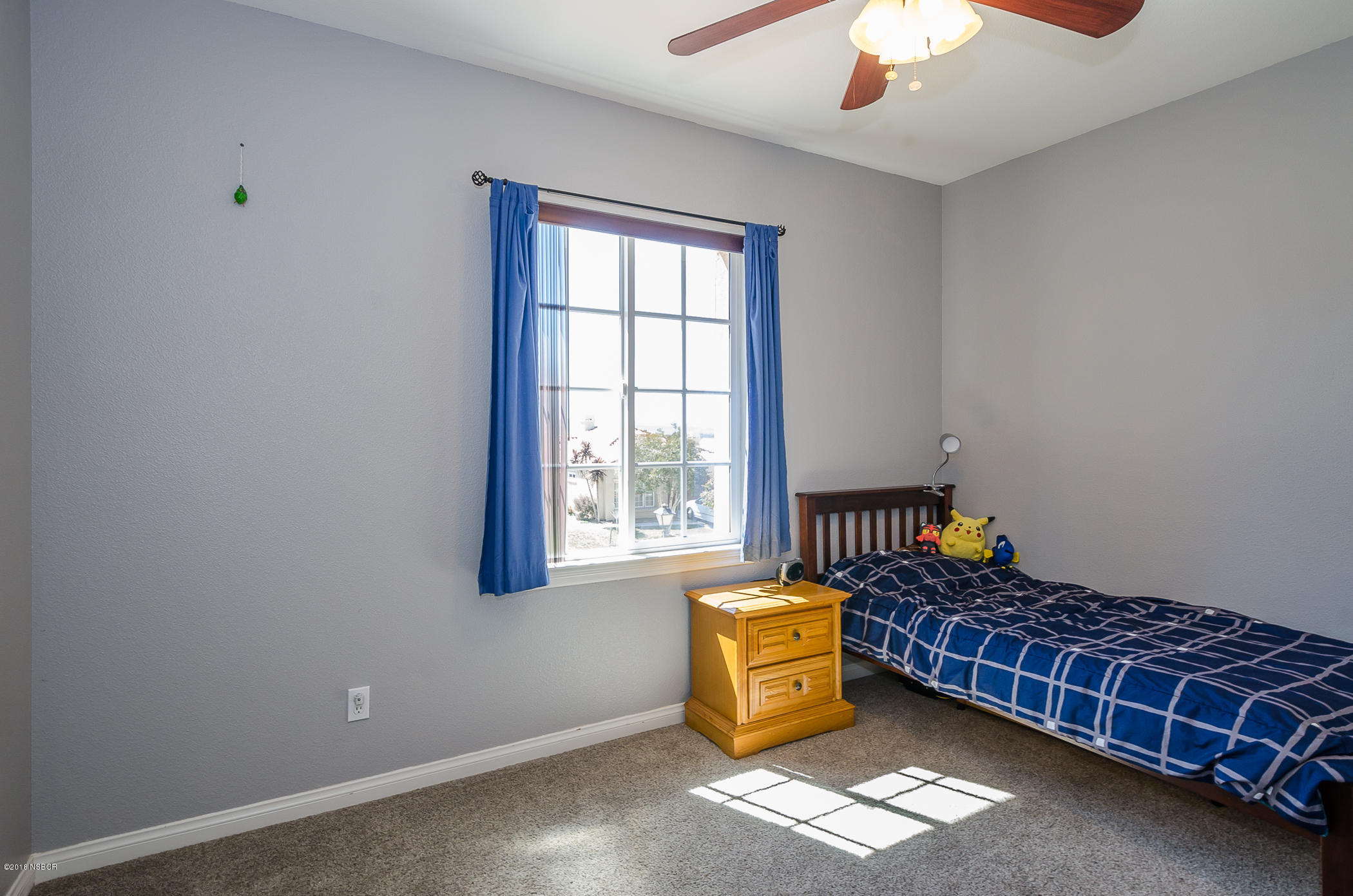 716 Enterprise Avenue Lompoc, CA 93436 - Photo 28 of 43 a bed room with a bed and a window
