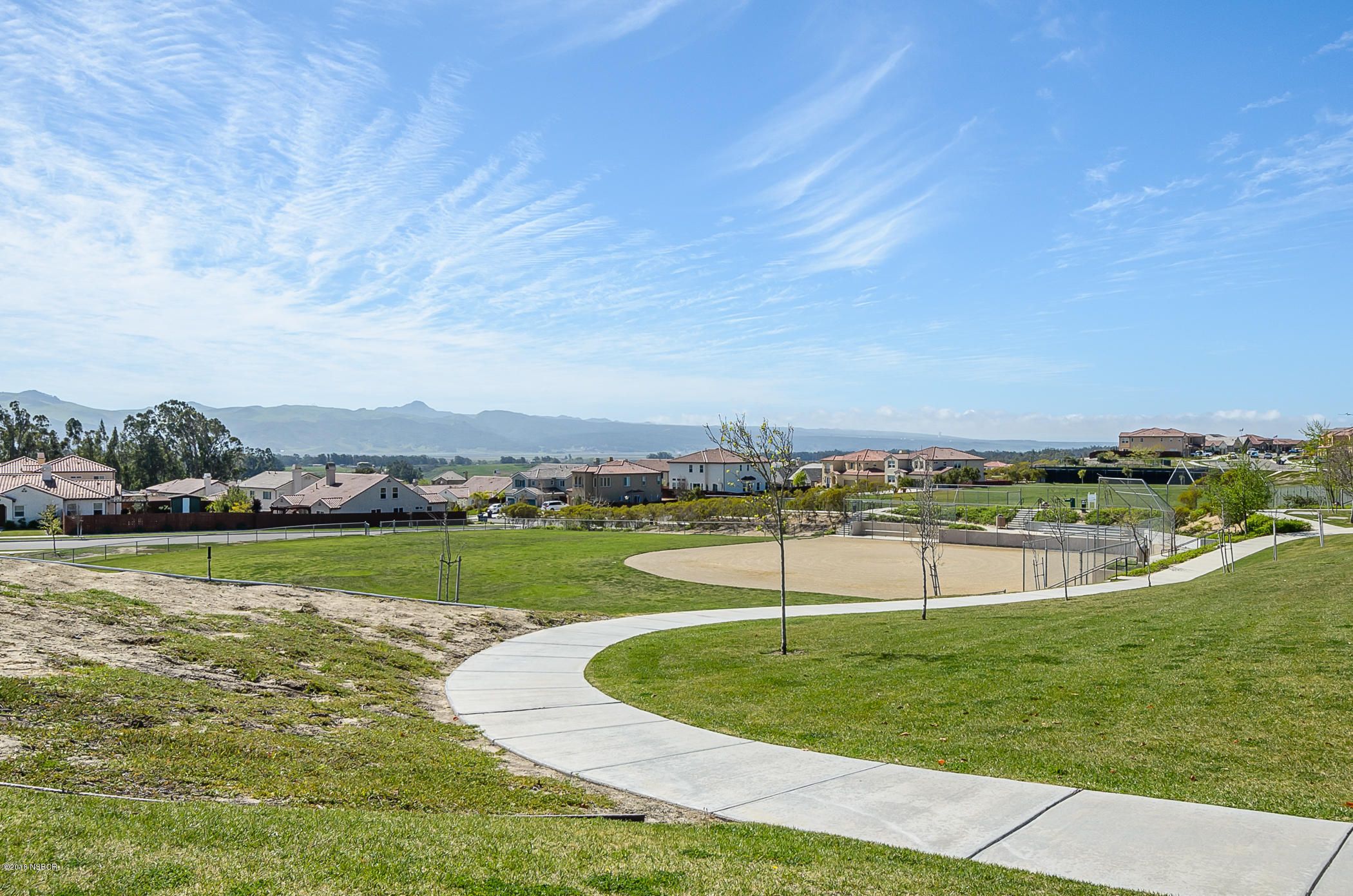716 Enterprise Avenue Lompoc, CA 93436 - Photo 39 of 43 a view of a swimming pool with a yard