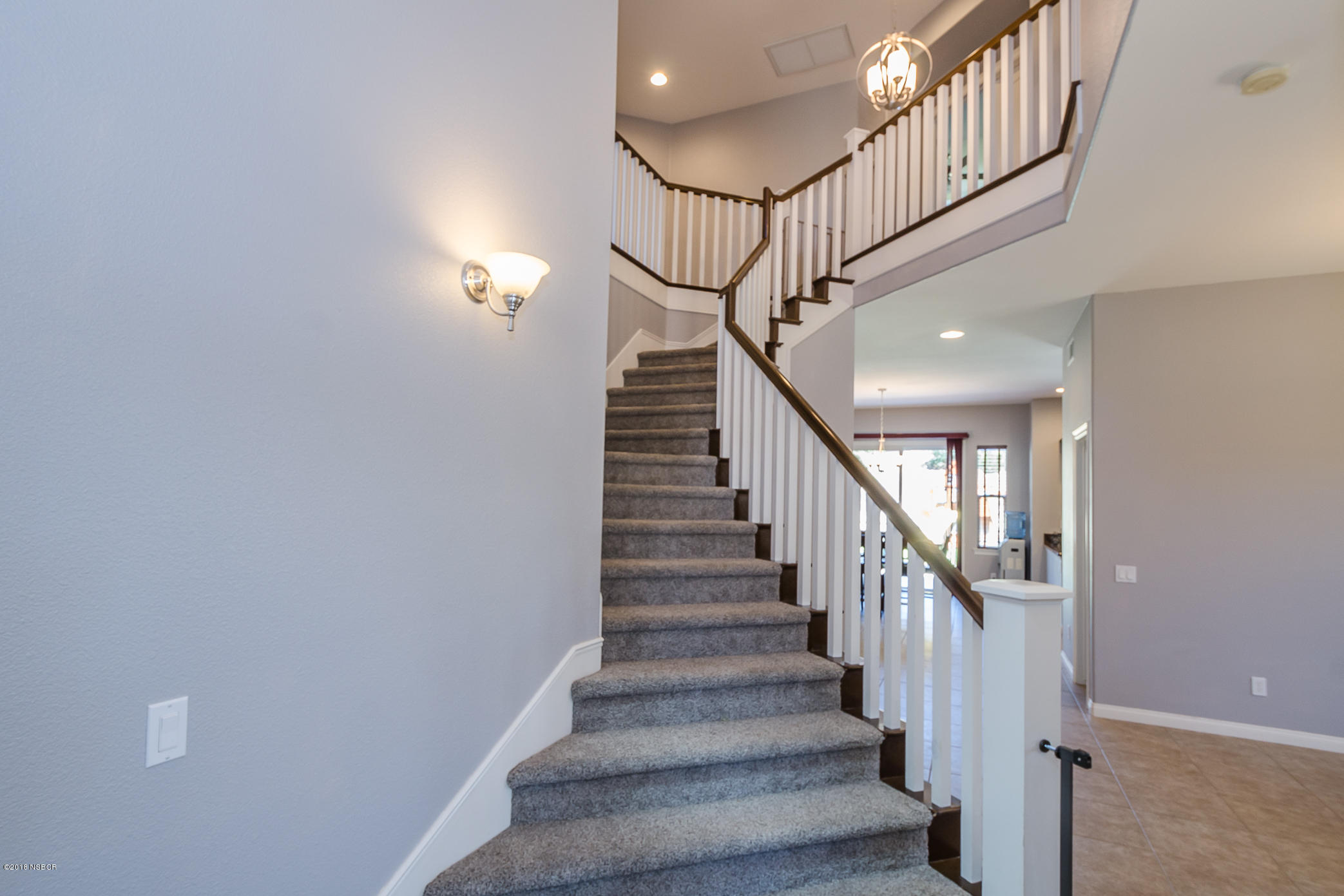 716 Enterprise Avenue Lompoc, CA 93436 - Photo 5 of 43 a view of staircase with wooden floor and white walls