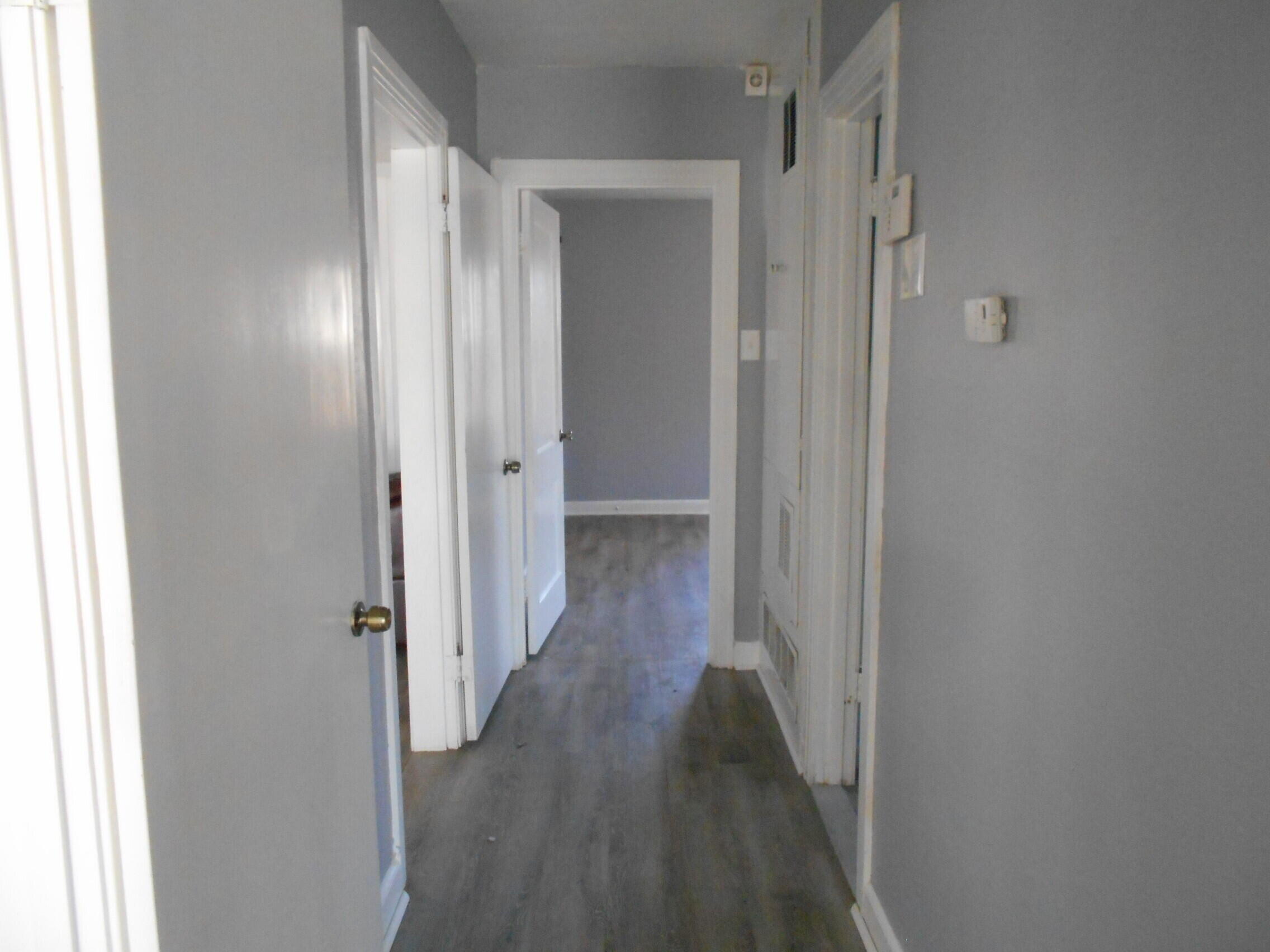 2614 31st Street Lubbock, TX 79410 - Photo 12 of 15 a view of a hallway with wooden floor