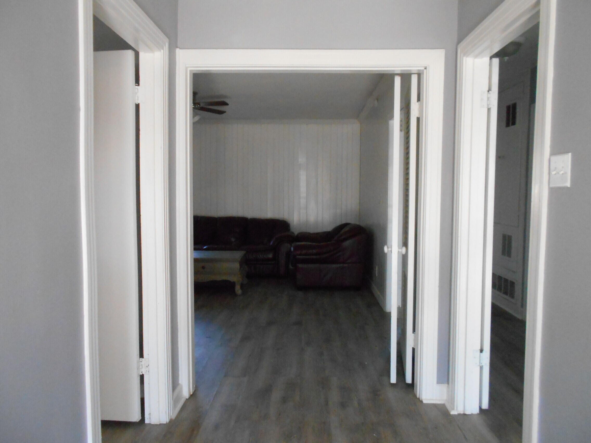 2614 31st Street Lubbock, TX 79410 - Photo 3 of 15 a living room with furniture and a closet