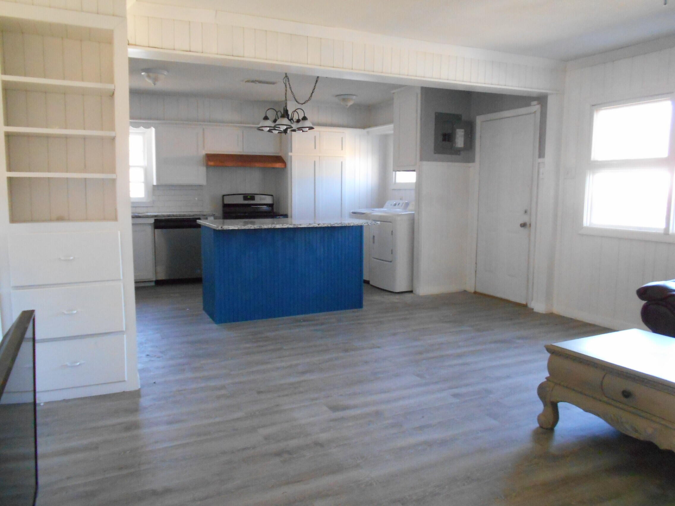 2614 31st Street Lubbock, TX 79410 - Photo 4 of 15 a kitchen with a wooden floor and kitchen view