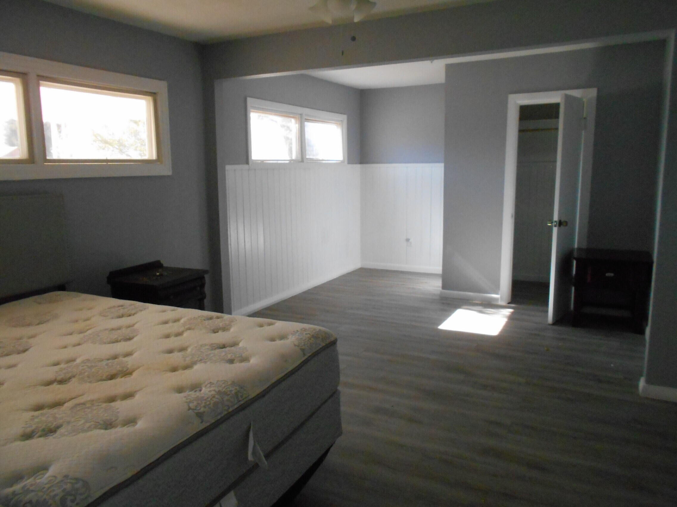 2614 31st Street Lubbock, TX 79410 - Photo 7 of 15 a bedroom with a bed and a window