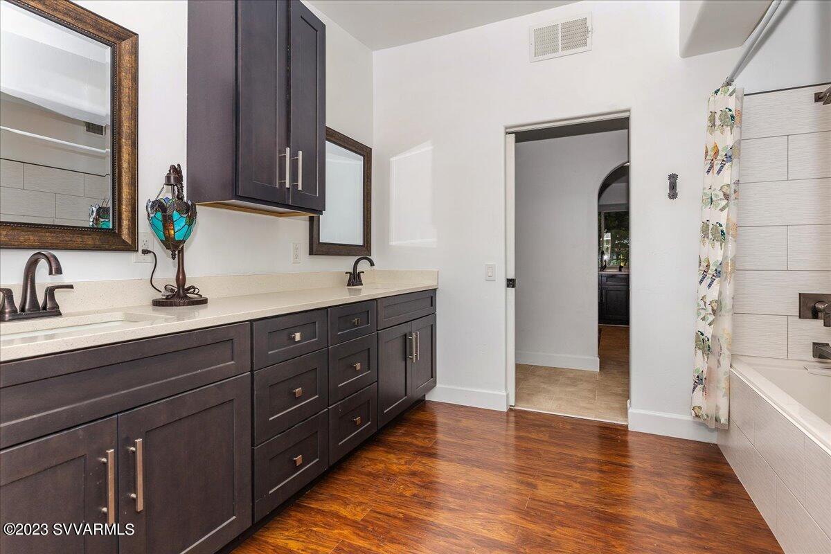 143 East Walker Road Camp Verde, AZ 86322 - Photo 14 of 42 a spacious bathroom with double vanity and a mirror