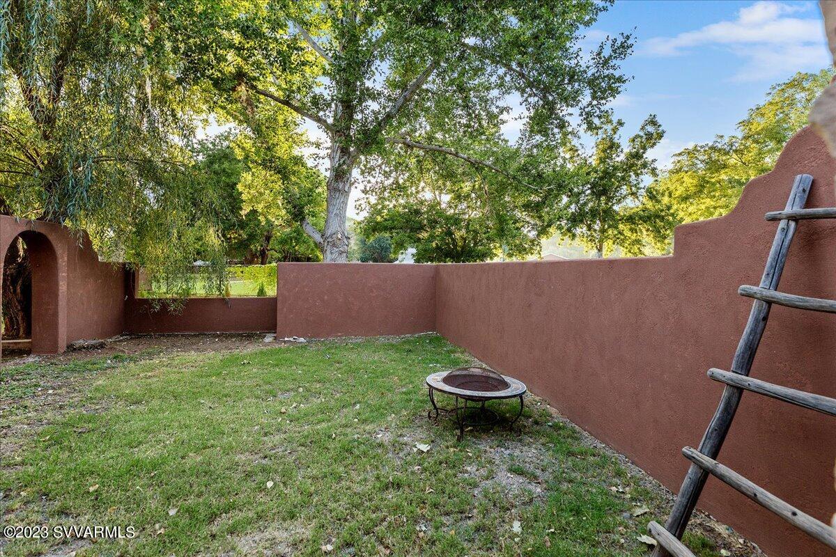 143 East Walker Road Camp Verde, AZ 86322 - Photo 29 of 42 a view of a backyard with plants and a fence