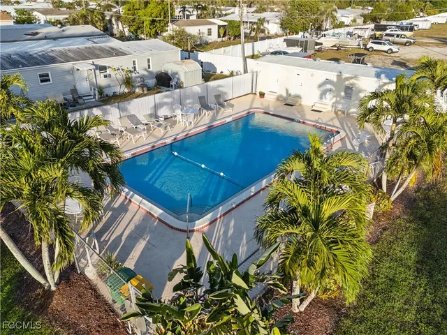aerial view of a house with a yard