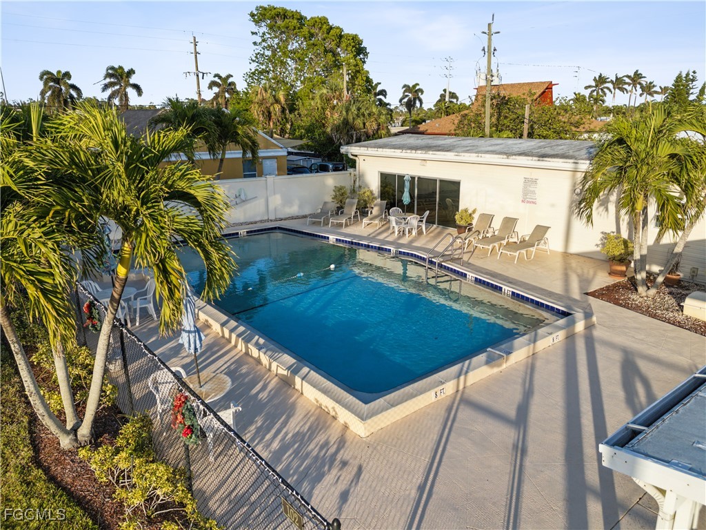 455 Cape Florida Way Naples, FL 34104 - Photo 15 of 35 a view of a house with swimming pool