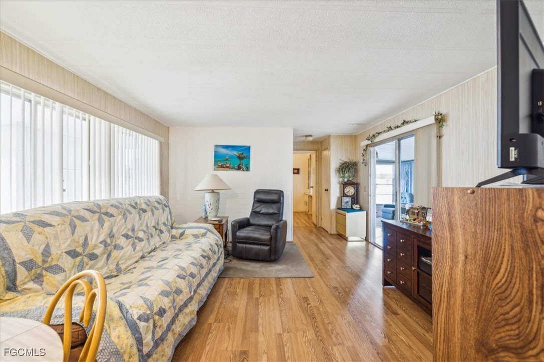 455 Cape Florida Way Naples, FL 34104 - Photo 21 of 35 a bed room with a bed and a couch