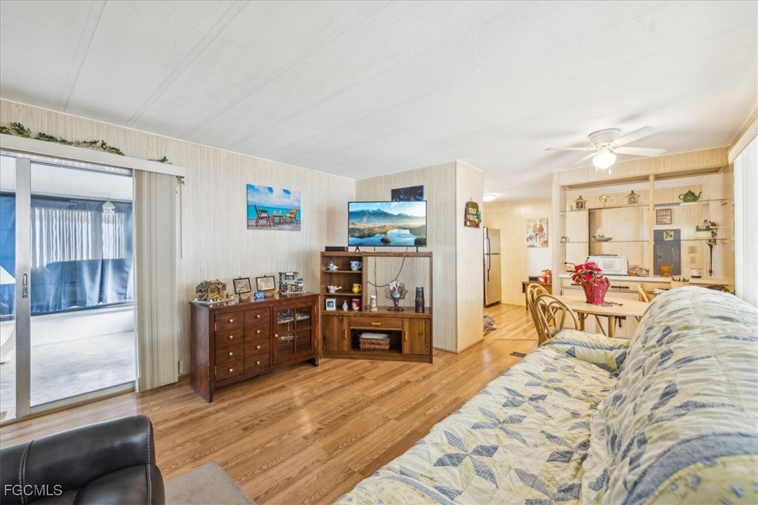 455 Cape Florida Way Naples, FL 34104 - Photo 22 of 35 a bed room with a bed and furniture