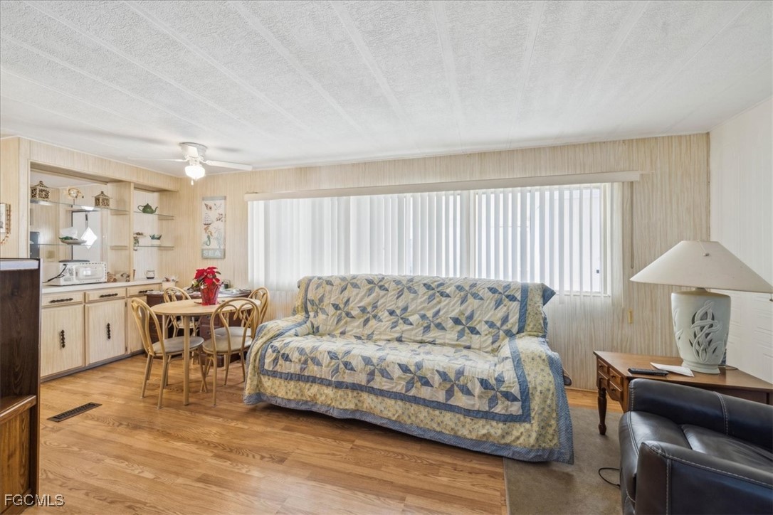455 Cape Florida Way Naples, FL 34104 - Photo 24 of 35 a living room with furniture and a table
