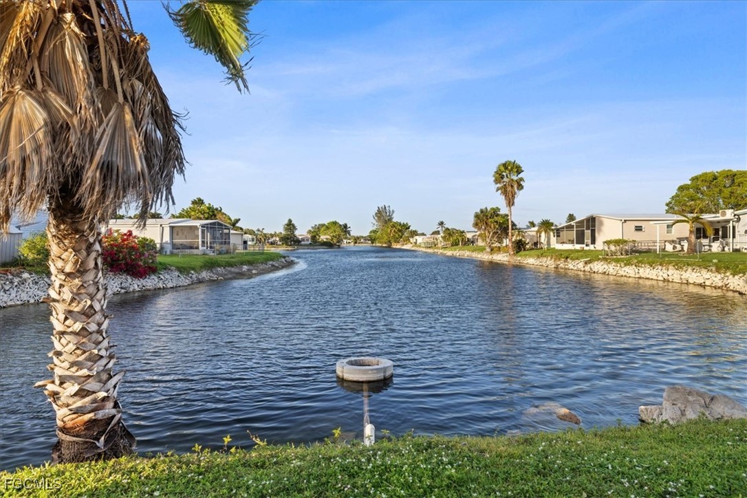 455 Cape Florida Way Naples, FL 34104 - Photo 35 of 35 a view of a lake with outdoor space