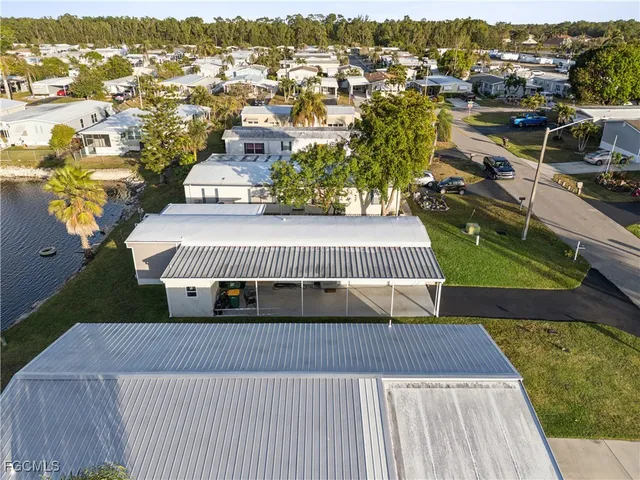 an aerial view of a house with a swimming pool