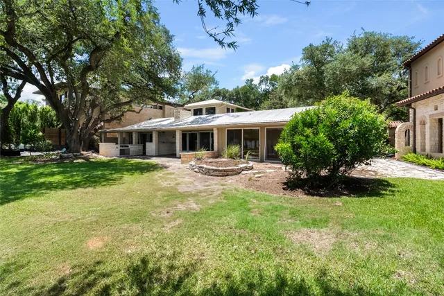 a view of a house with a yard porch and sitting area