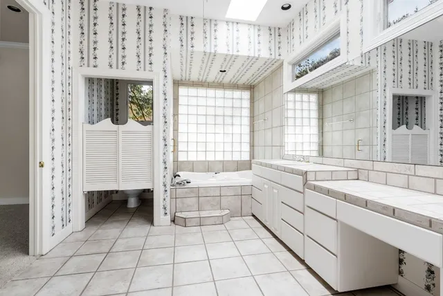 a bathroom with a bathtub and a sink