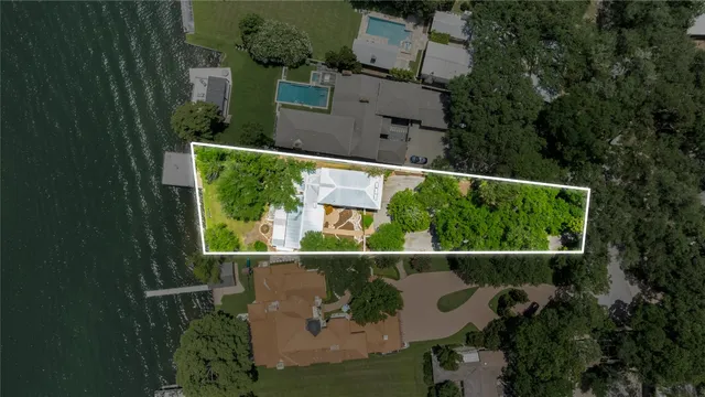 an aerial view of houses with yard