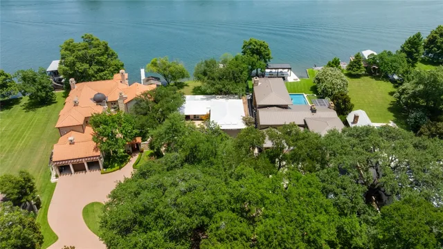 an aerial view of house with yard swimming pool and outdoor seating