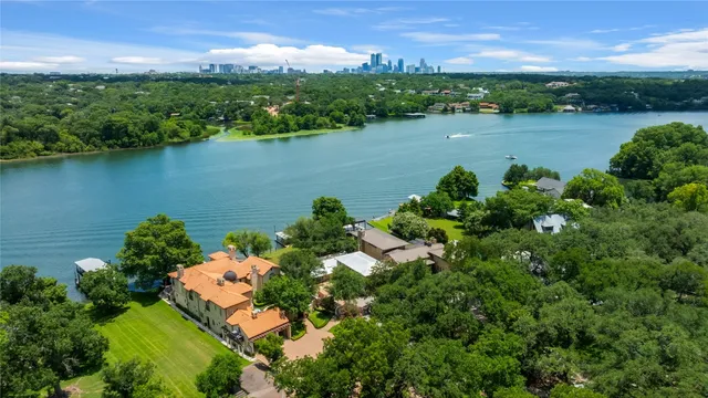 a front view of a house with a yard garage and outdoor seating