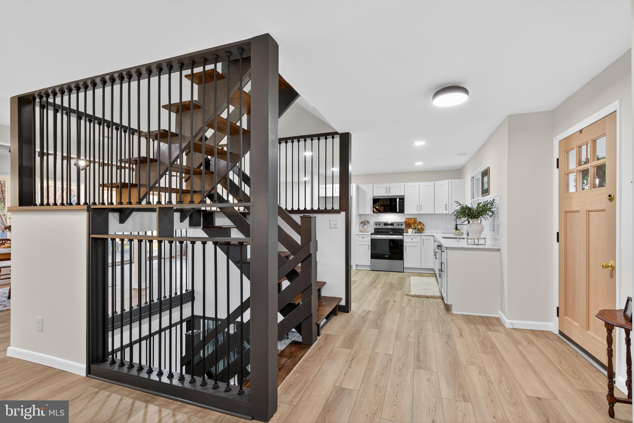 119 Oaks Road Oxford, PA 19363 - Photo 1 of 58 a view of a hallway with wooden floor and staircase