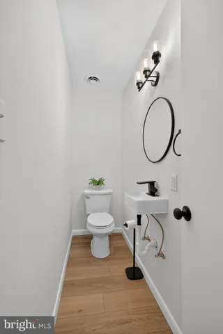 a view of a livingroom with wooden floor