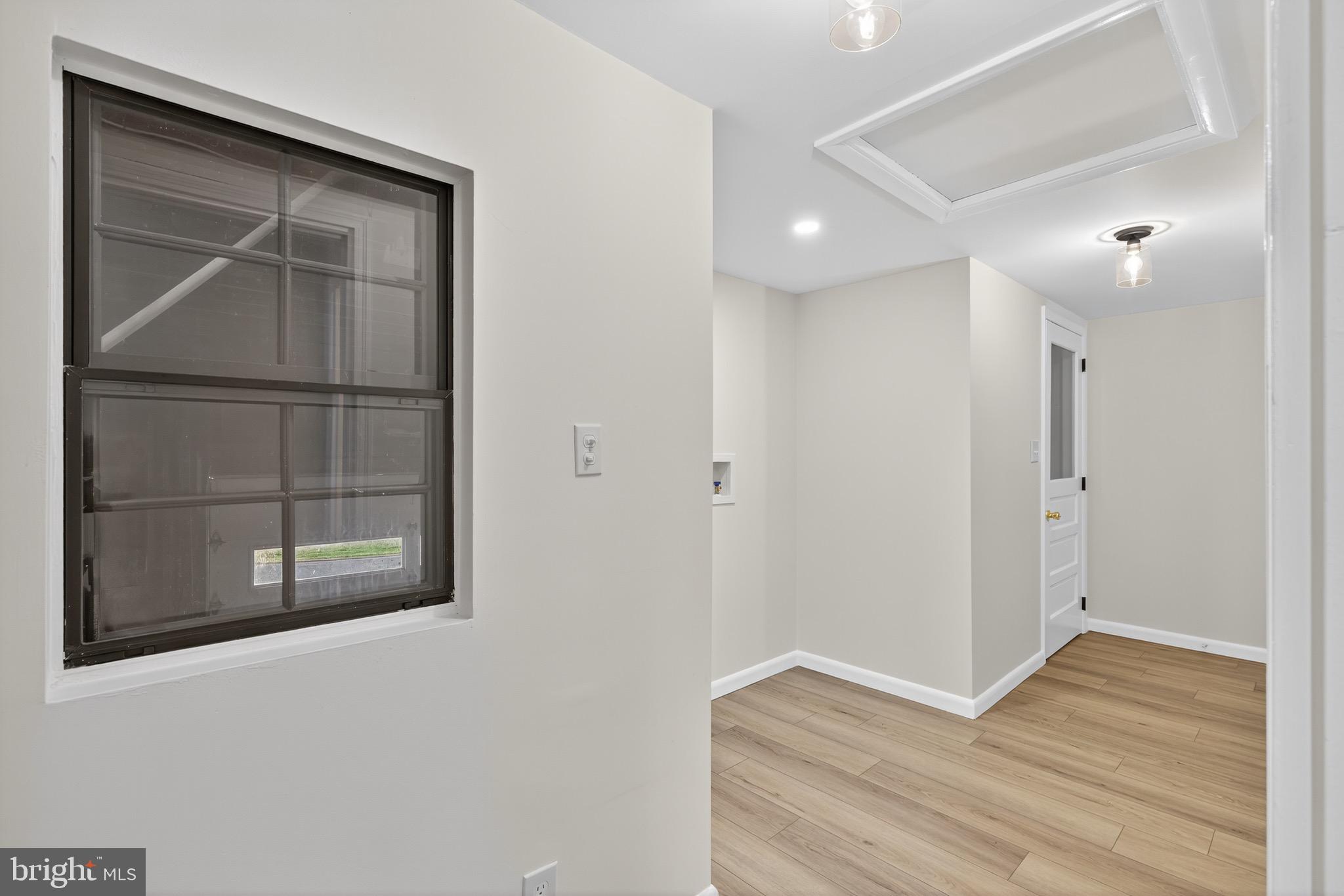 119 Oaks Road Oxford, PA 19363 - Photo 21 of 58 a view of an empty room with wooden floor and a window