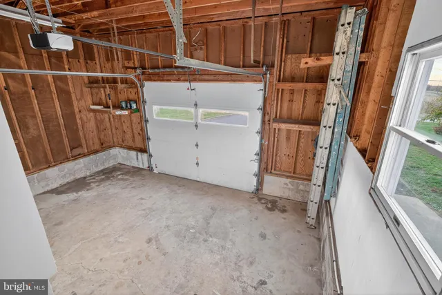 a bedroom with a bed and a night stand