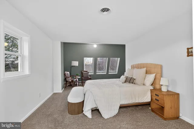 a bathroom with a shower a toilet and a sink