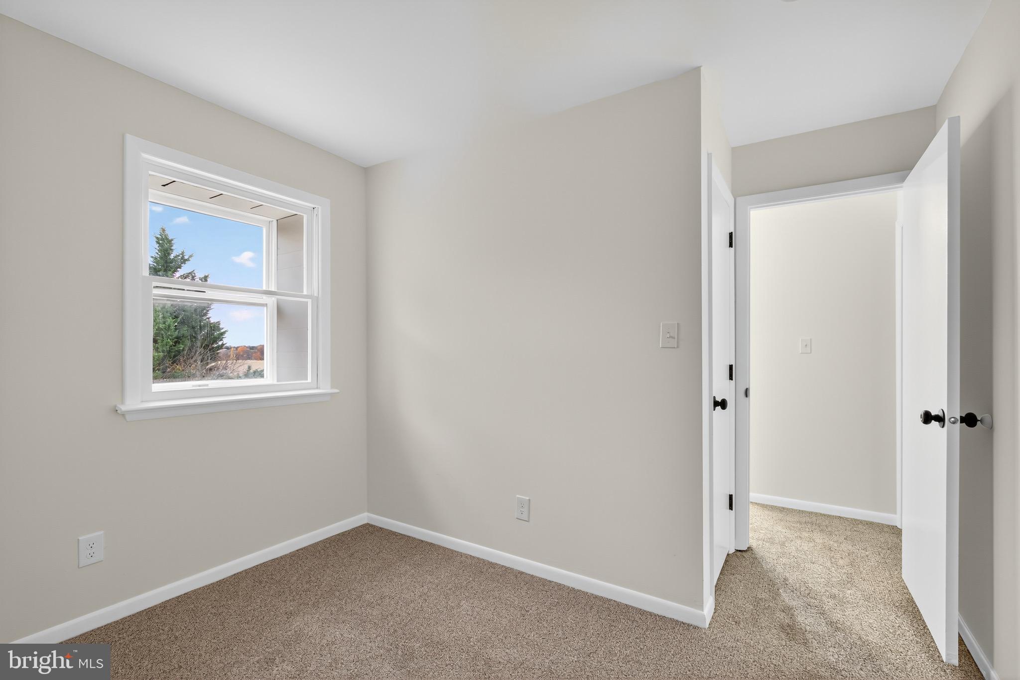 119 Oaks Road Oxford, PA 19363 - Photo 37 of 58 a view of an empty room with window and closet area