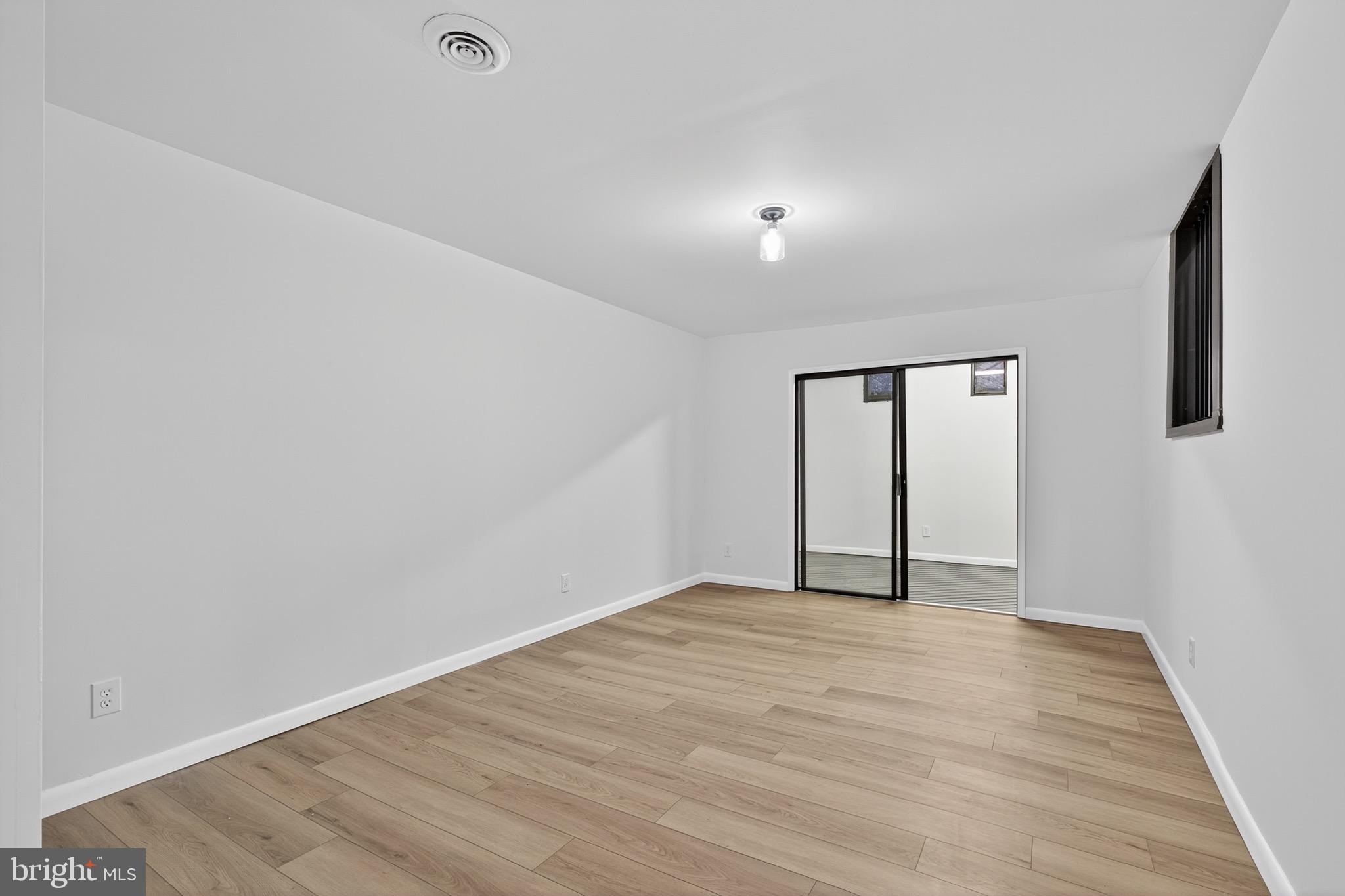 119 Oaks Road Oxford, PA 19363 - Photo 41 of 58 a view of an empty room with wooden floor