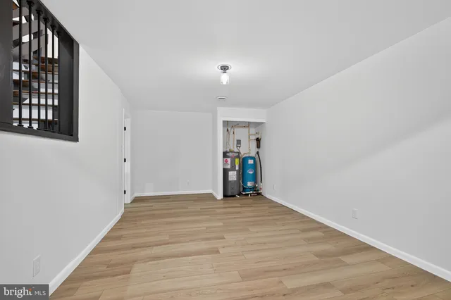 an aerial view of a house with outdoor space and lake view