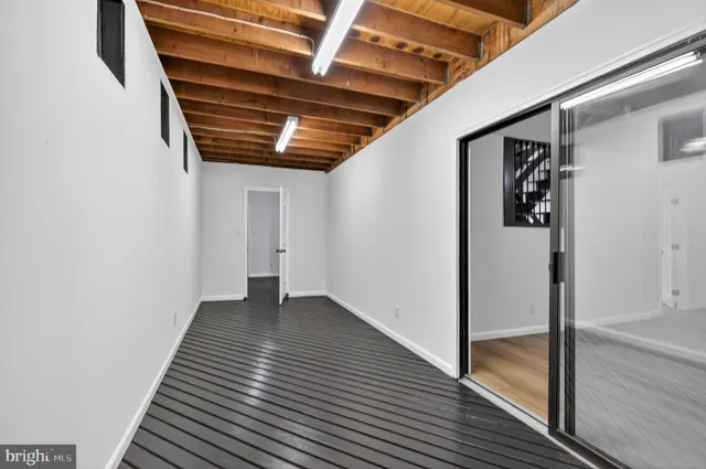 a view of a house with a yard and lake view